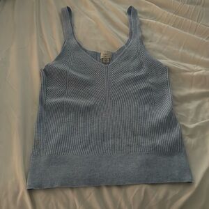 Soft strechab baby blue tank top with line designs on the mid front part